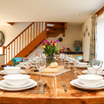 dining table with stairs behind