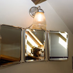 drych ffansi ar y wal